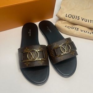LOUIS VUITTON Lock It Slides Brown Monogram Sandals Flats With Gold LV Size 39.